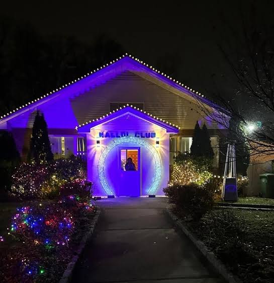 Kallol Club House illuminated at night