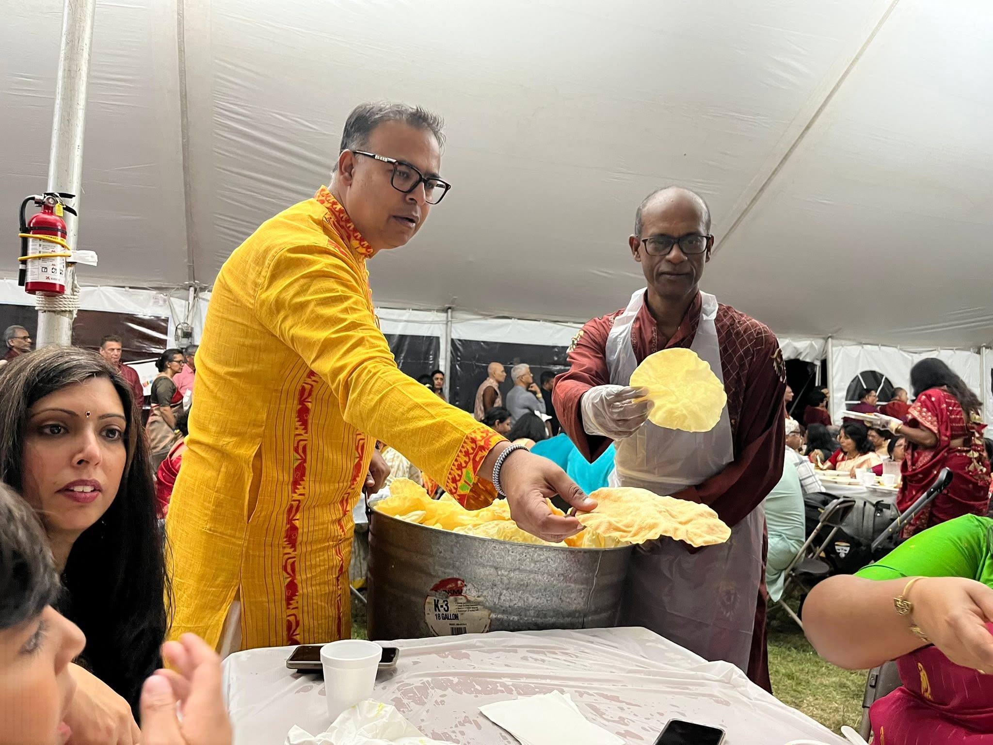 Kallol volunteers serving food during Durga Puja