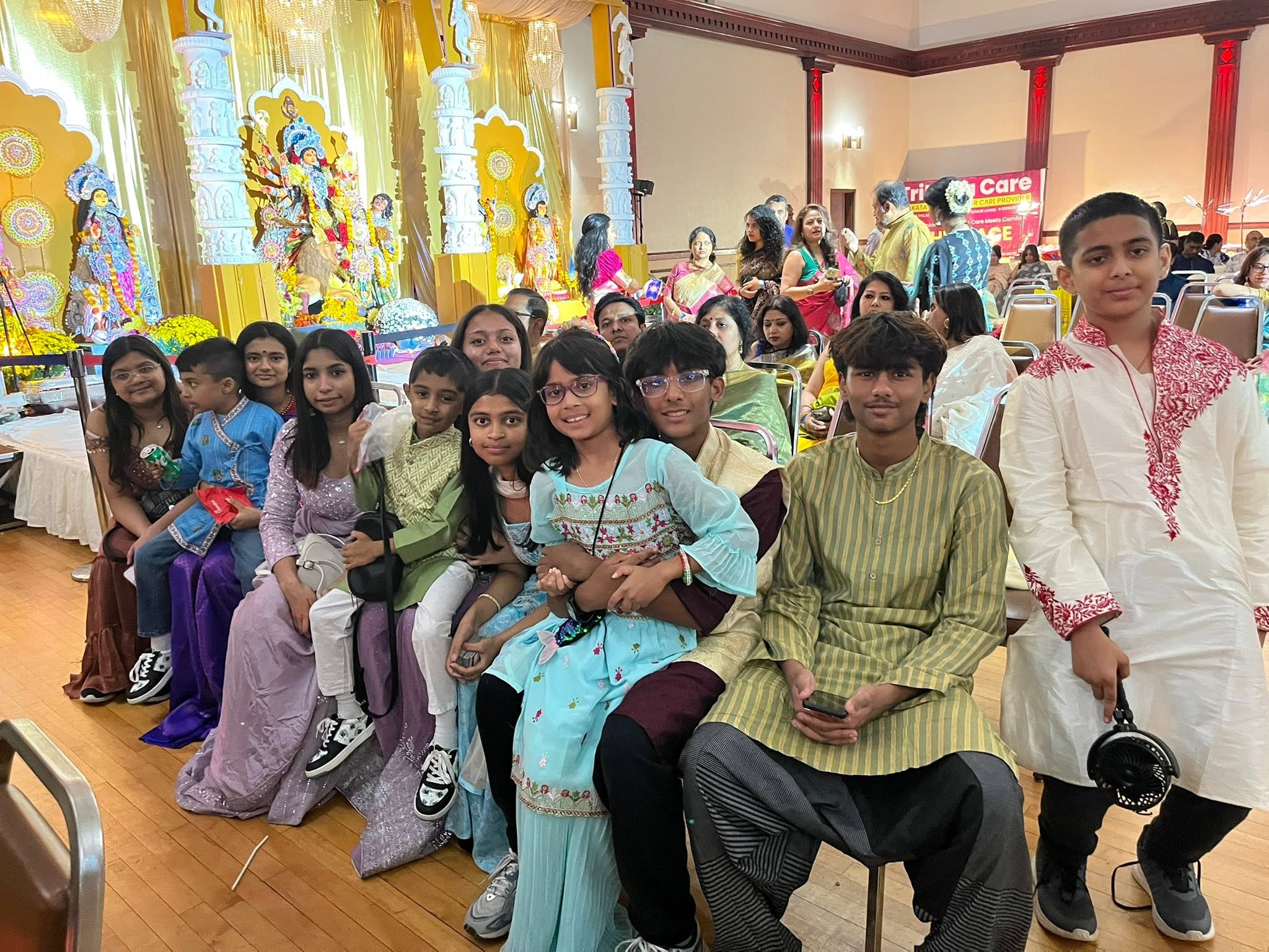 Young members of the Kallol community enjoying Durga Puja